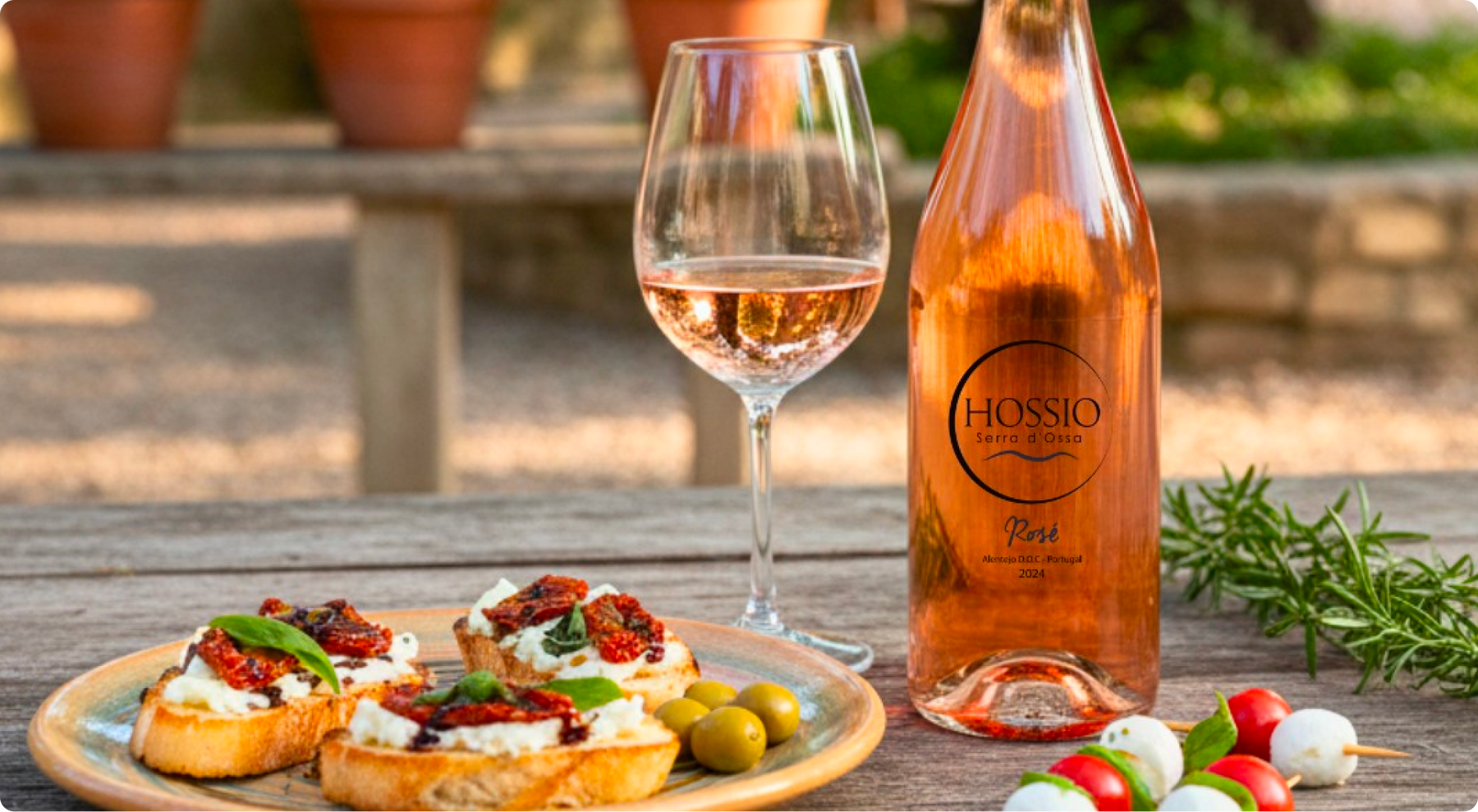 Hossio Rosé served with food at an outdoor table